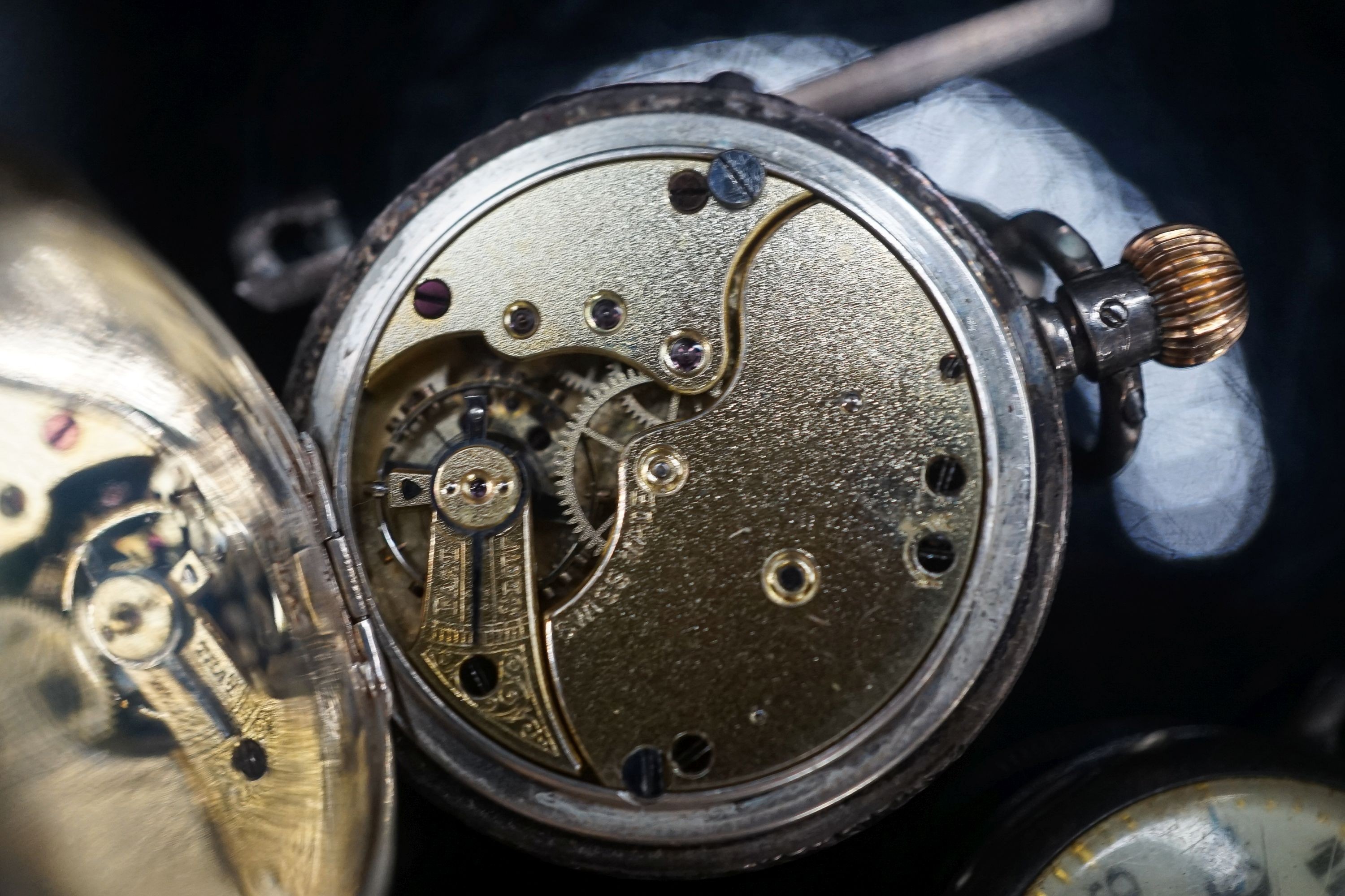 A gentleman's early 20th century continental 18k half hunter wrist watch, case diameter 33mm, gross weight 32.7 grams, together with two other silver watches.